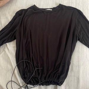 Womens black shirt with elastic bottom to make loser or tighter. Only worn twice